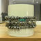 This stretch handmade bracelet is sold as a set of 5. The metal beads are various size and shape, there are some turquoise color seed beads.